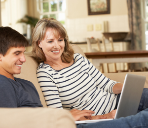 teenager on sofa with carer